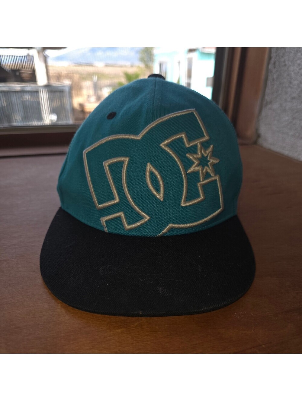 DC Shoes teal cap size 6 and 1/2 to 6 and 7/8